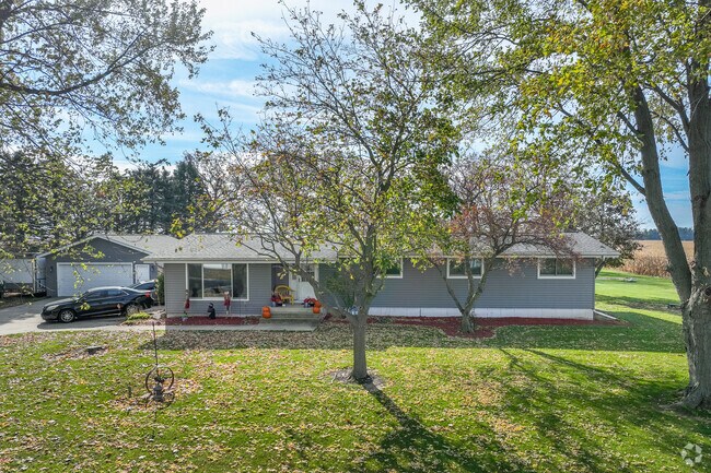 Grey ranch style home with shutters in Virgil.
