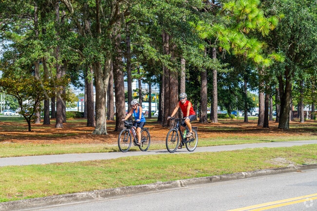 Bikers enjoy the 15 miles Cross City Trail that runs through College Park-Fernside.