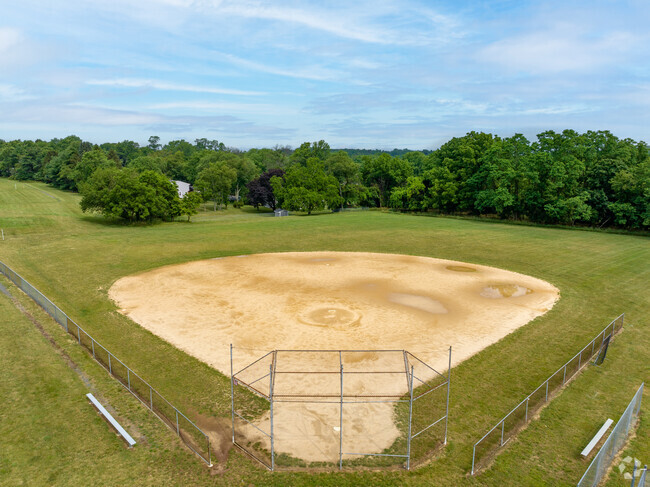 Dwight D. Eisenhower Elementary School has a baseball diamond in a park like setting.
