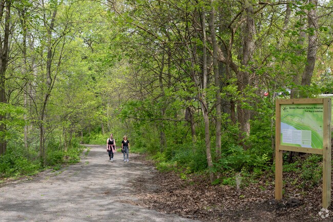 Trails wind through heavily wooded areas at Bender Mountain Preserve in Delhi Hills.