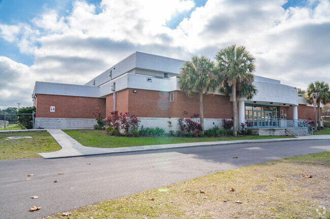 Monroe Middle School's gym sits in the back of the park.
