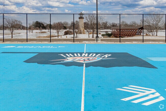 Play a game of basketball against some friends at Ackley Park.