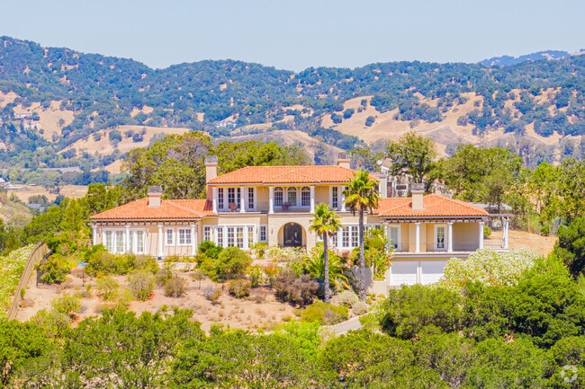 A large mediterranean mansion sits above Venetia Valley.