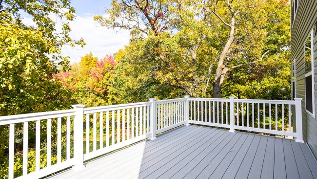 Enjoy peaceful wooded views from this spacious rear deck of the Glenshaw II floor plan.