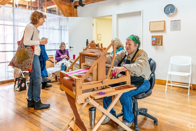 Volunteers create textiles out of wool at the Sheep to Shawl Festival in Salem.