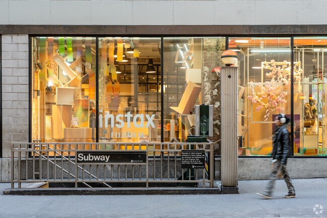 Residents and visitors of Garment District navigate the city via the subway system.
