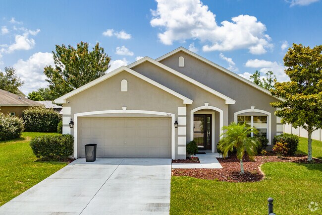 A Ranch style home with a two car garage in Boca Vista.