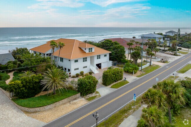 Tile roofs and Spanish influences are popular features in this row of Wilbur-by-the-Sea homes.