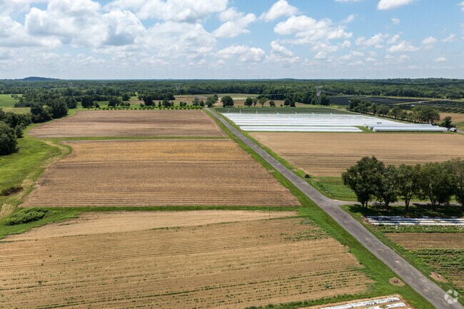Farmland stretches out far and wide, providing the community with its own bountiful harvest.