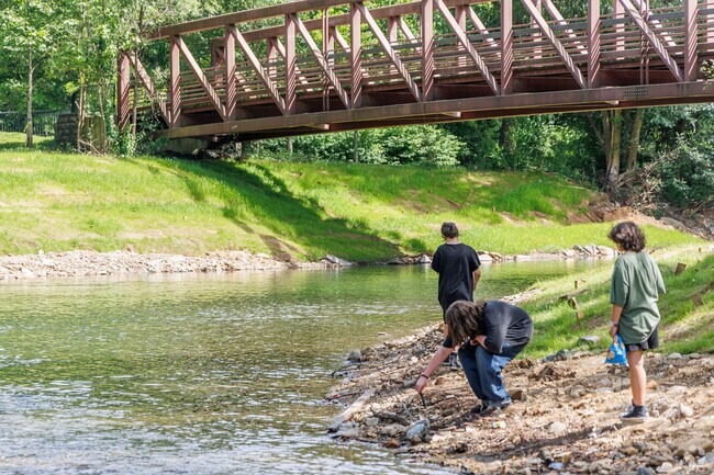 Take comfort knowing that kids still play in the creek in Baltimore, like at Herring Run Park.