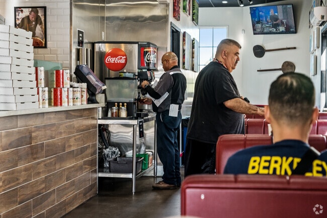Slice House Pizza bustling with diners enjoying a slice near Carlmont.