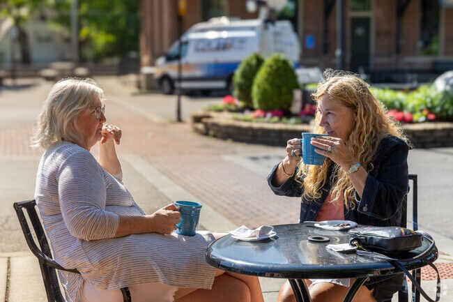 Enjoying a cup of coffee along Glendale's Village square.