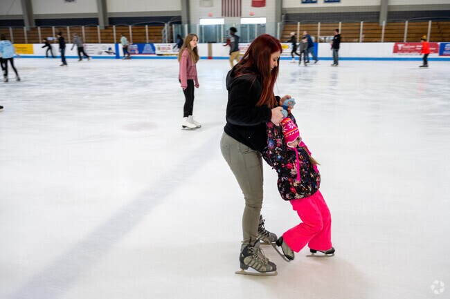 A child learns to ice skate at Daniel S. Horgan Rink in Auburn.