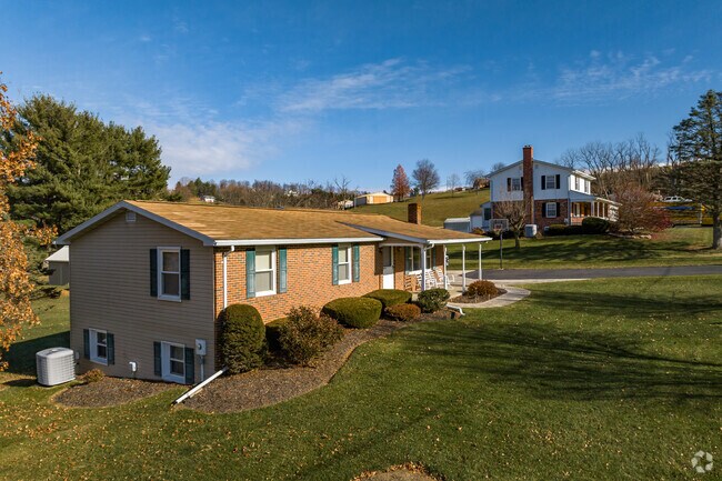 A modest row of split-level homes on large lots in rural Wolfsville.