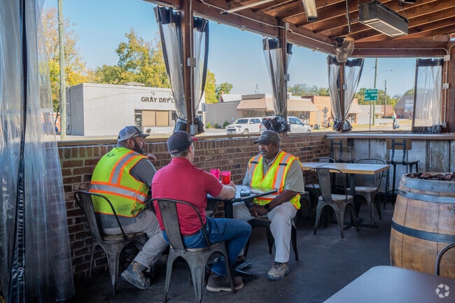 Residents of Evergreen Plantations eat lunch at Bent Axel in Gray.