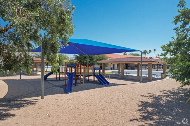 There are covered seating and playground in the courtyard at St. Gregory Elementary School.
