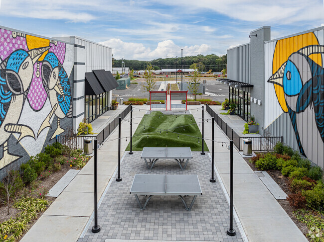 Murals are found along a small park between stores of a strip mall in Old Bridge.