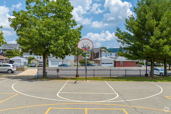 Students of Jefferson Elementary School have a basketball court outside.