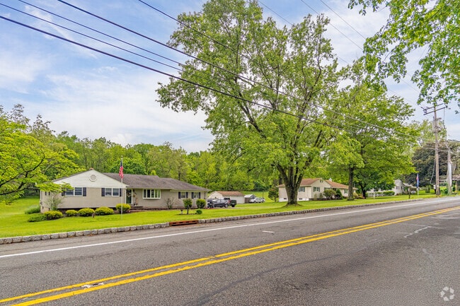 With wide lawns and American flags waving gently in the breeze, this stretch of Readington radiates small-town serenity.