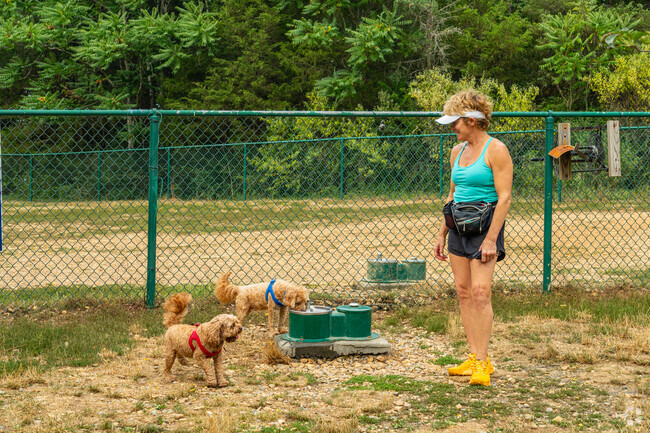 There are multiple water bowls for your dogs on hot days at Smithland Road Dog Park.