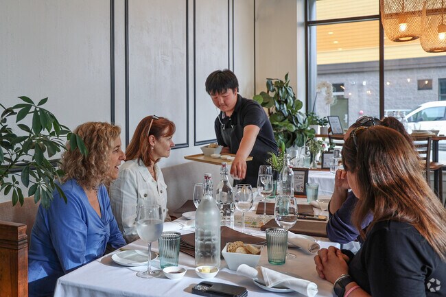 In the warm glow of evening, Ryal Side diners gather at Passport restaurant in downtown Beverly to savor globally inspired, boldly seasoned dishes while lingering over unhurried, thoughtful conversation.