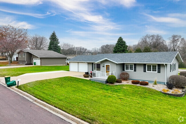 Single-level ranch homes showcase landscaped lawns along Jackson streets.