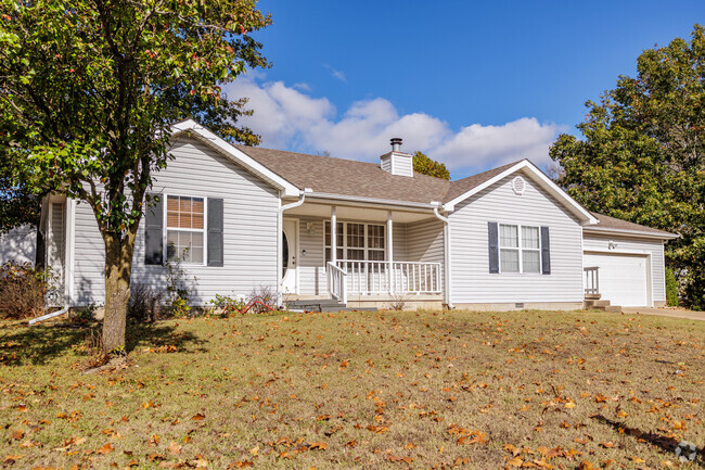 A modern ranch style home in Forest Ridge includes a sizeable front porch.