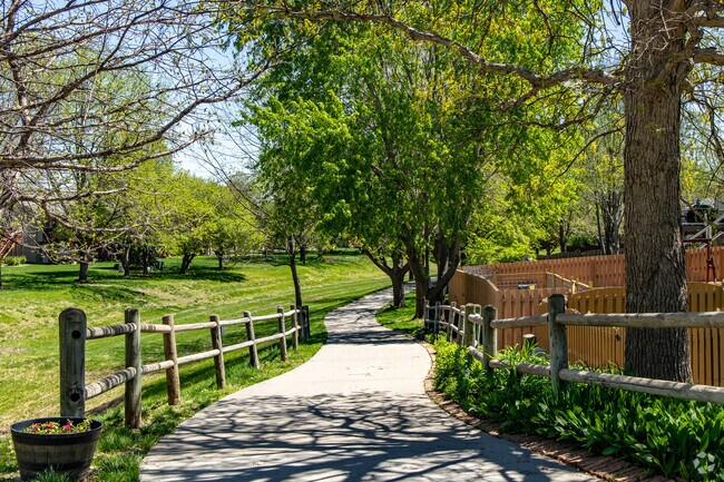Walking trails thread through shaded groves in the Millard Park's namesake park.