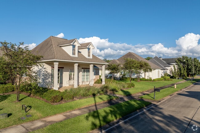 Sidewalk-lined streets run throughout The Lakes District in Alexandria.
