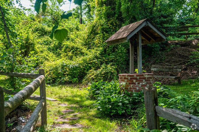 Scenic trail with historic well at Morris Canal Preserve in Little Falls.