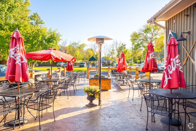 Outdoor seating at Surfside Bar and Grill offers lake views in Mound.