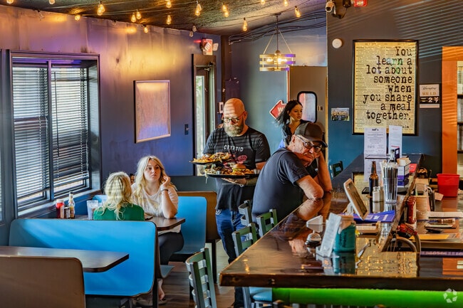 Friends meet for burgers and great conversation at Fat Bottom Grille in Keyser.