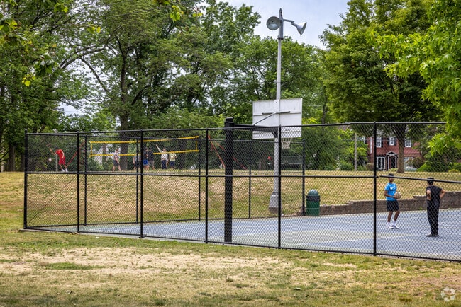 People playing basketball and beach volleyball at Taylor Park, Millburn, NJ.