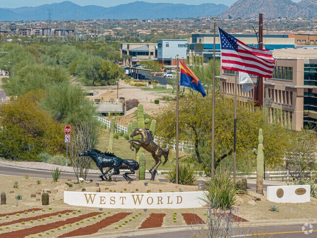 The sculptures and patriotic flags displayed at the sign for West World.