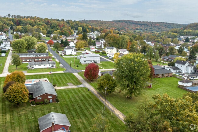 Dunbar is nestled amidst tree-covered hills.
