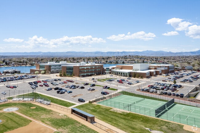 Westminster High School entrance view showing sports fields, tennis courts parking and Hidden Lake