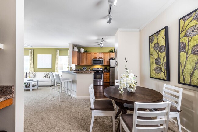 1 Bedroom with Sunroom: Dining Room looking into Living Areas