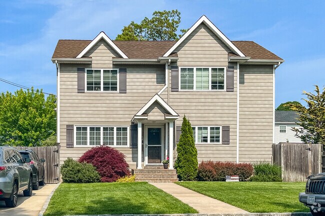 Colonial Revival style homes come with large front and back yards in Deer Park.