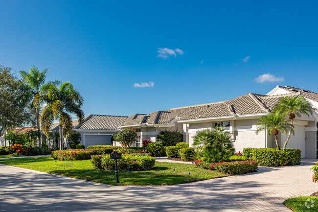 Wyndemere features single story stucco homes with tropical landscaping.