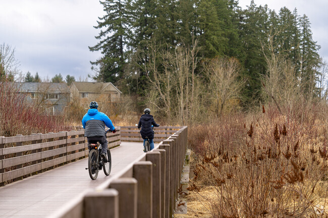 Oak Hills residents enjoy views of the Crystal Creek Wetlands as they trek along the Waterhouse Trail.