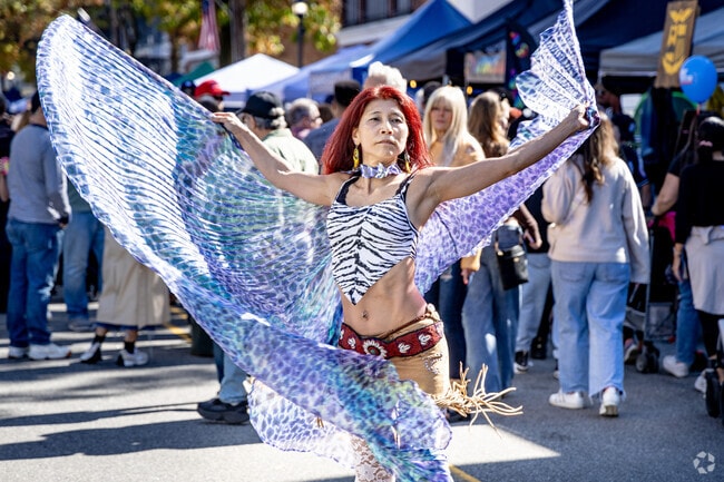A dancer entertains the crowd at the Oyster Festival.