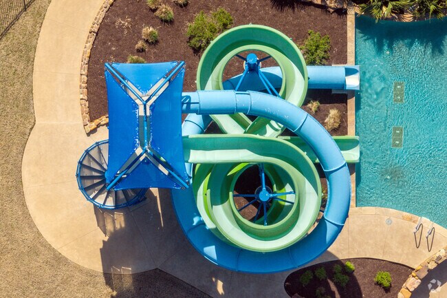 Kids in Heartland love exploring the winding tunnels at the water park in The Oasis at Heartland.