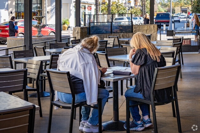 Sit outside and enjoy a meal at The Yard House near Harveston.