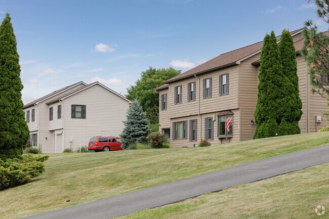 A street with large townhouses in East Ithaca offers residents extra large yards.