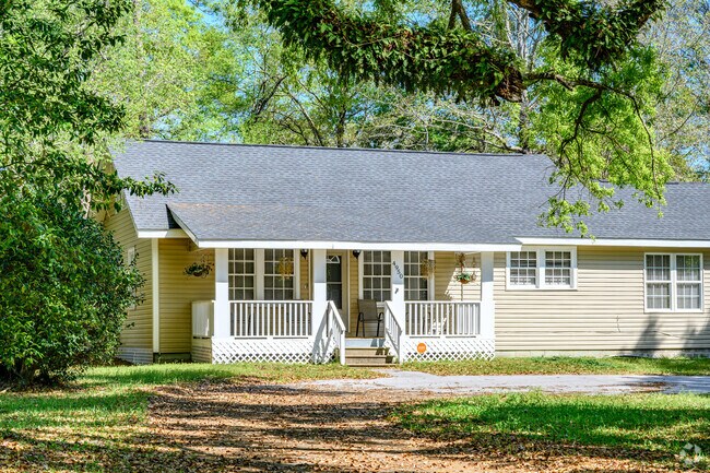 The trees framing this home in Bellewood give it a cozy and quaint look.