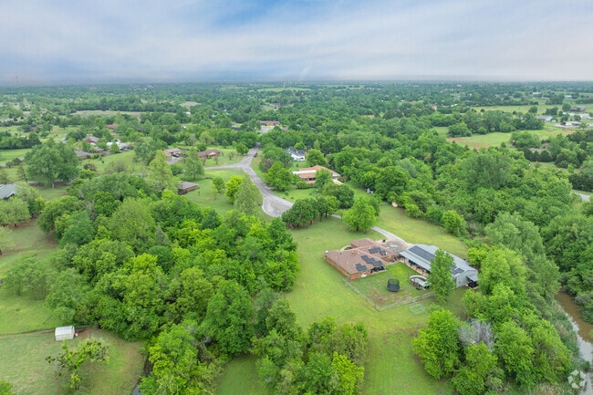 Find a home with dense trees and larger lots in West Mustang.