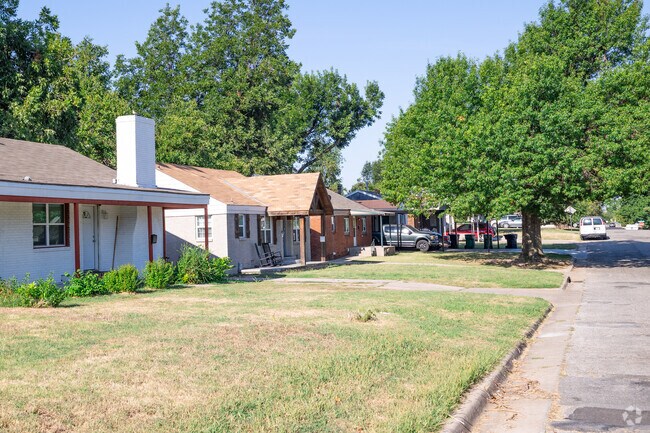 The mature trees in Denniston Park canopy many of the houses with shade.