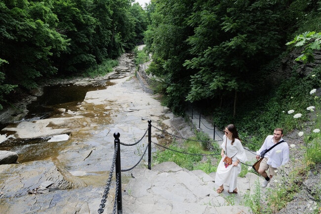 From Downtown Ithaca one can take the Cascadilla Gorge Trail up to Cornell University.