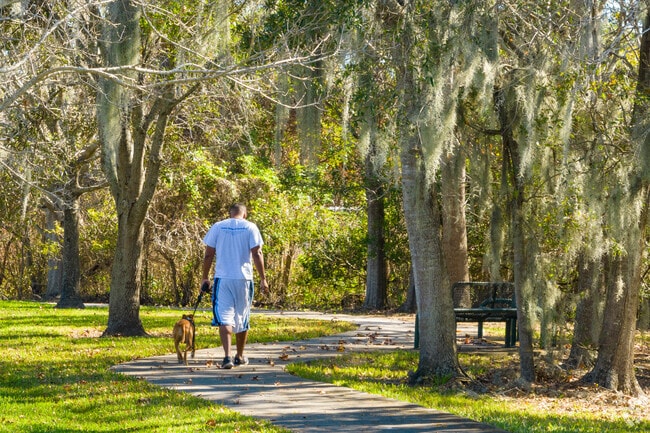 Residents enjoy Barnett Park Walking Trail with their pets.