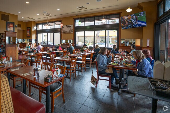 Indulging in savory delights at Crepevine restaurant in Willow Glen neighborhood.